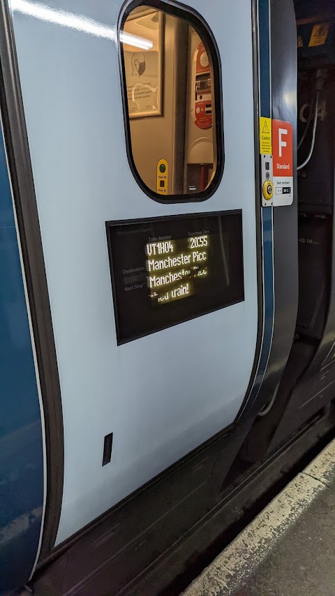 Image showing the display on a Pendolino train door, which shows the train number, departure time, destination, and next stop.